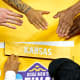 Apr 4, 2022; New Orleans, LA, USA; The Kansas Jayhawks place their name on the NCAA Tournament bracket after beating the North Carolina Tar Heels during the 2022 NCAA men's basketball tournament Final Four championship game at Caesars Superdome. Robert Deutsch-USA TODAY Sports